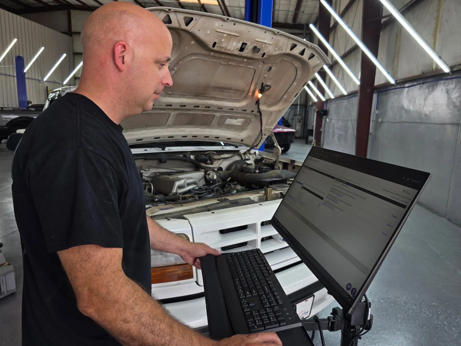 A-level mechanic testing check engine light issue on vehicle